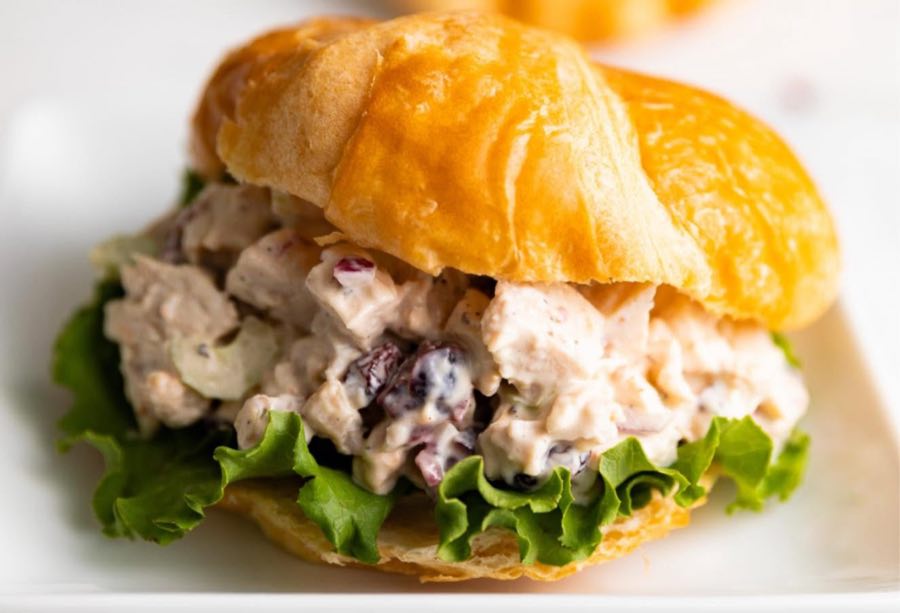 Chicken salad croissant with lettuce and dried cranberries